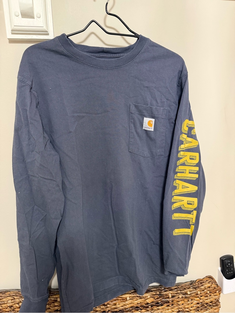 Carhartt Navy Long Sleeve Pocket Tee with Yellow Sleeve Logo Text